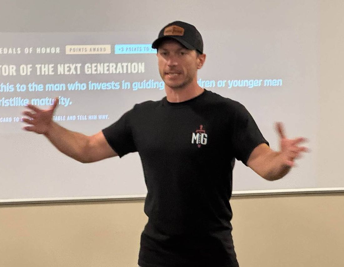 Dustin Alley teaching a room of men